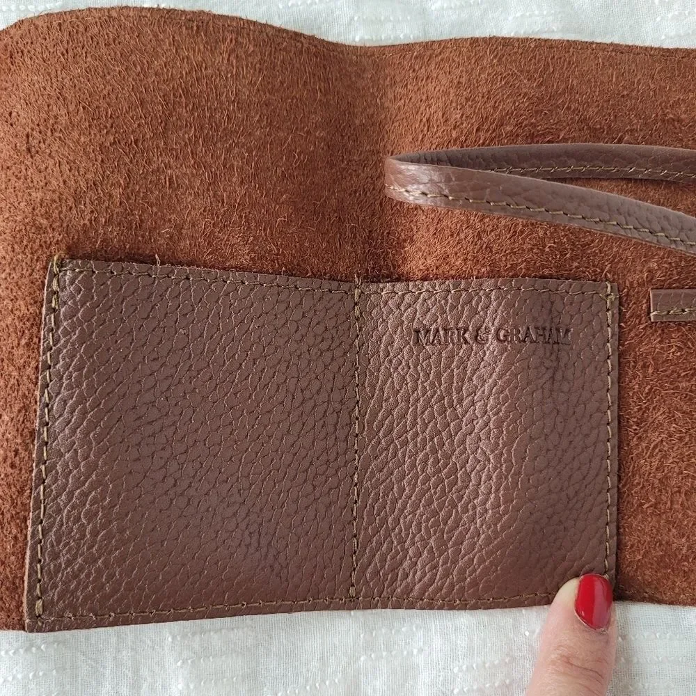 Mark & Graham brown pebbled leather charger rollup pockets tie closure minimal